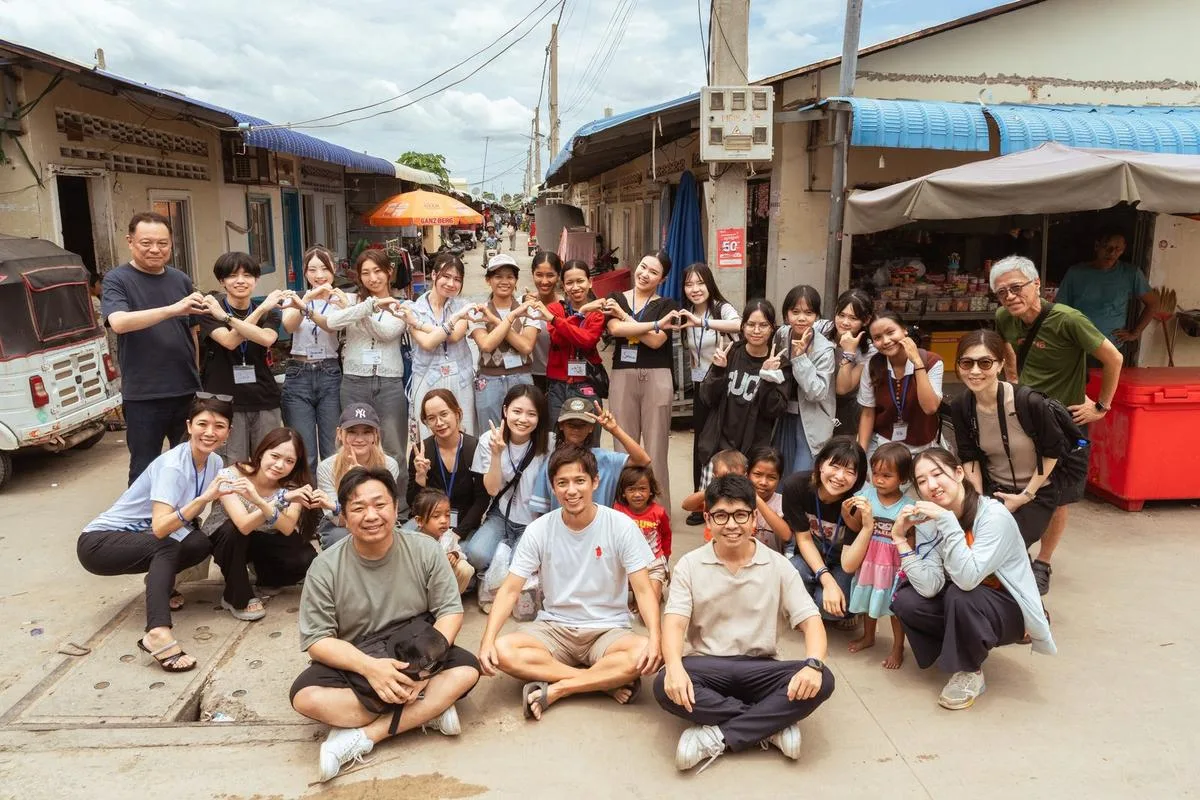 Japanese students and Cambodian children together on a village street